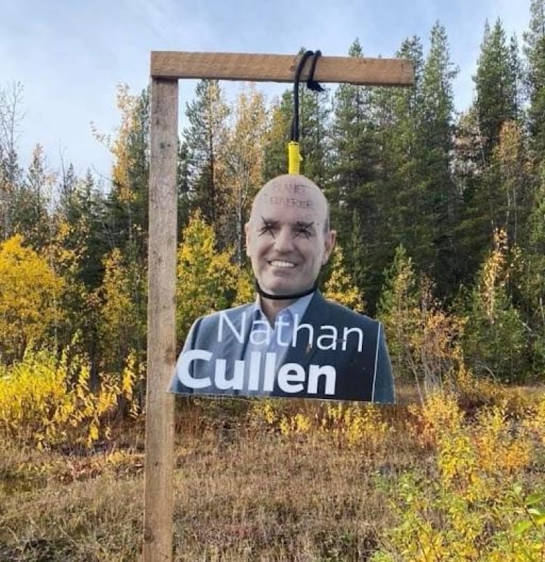 An image stolen from one of BC NDP candidate Nathan Cullen's signs hangs from a makeshift gallows by the side of a highway. 