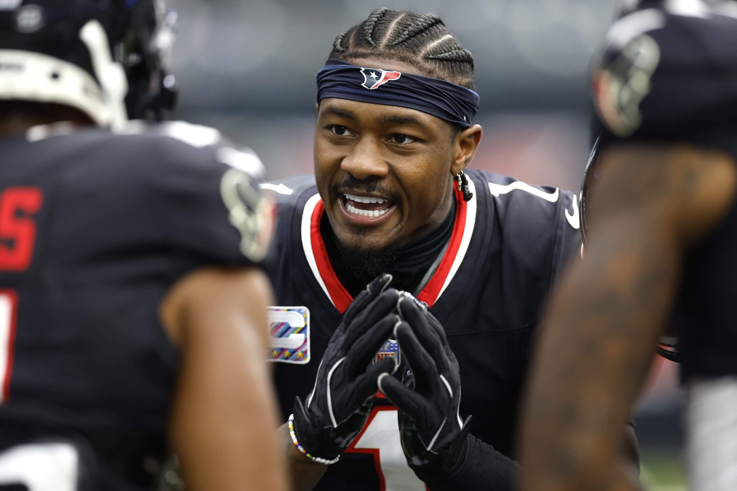 Stefon Diggs of the Houston Texans talks with teammates prior to a game against the Jacksonville Jaguars at NRG Stadium on September 29, 2024 in Houston, Texas.