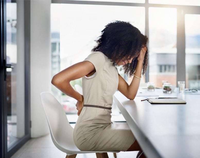 Woman Sitting Down Back Pain