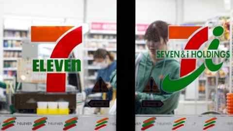 A customer shopping in a 7-Eleven convenience store in Tokyo