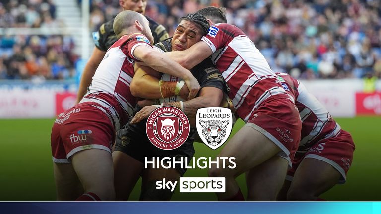 Picture by Olly Hassell/SWpix.com - 05/10/2024 - Rugby League - Betfred Super League Semi-final - Wigan Warriors v Leigh Leopards - The Brick Community Stadium, Wigan, England - Tom Amone of Leigh is tackled by Liam Marshall of Wigan