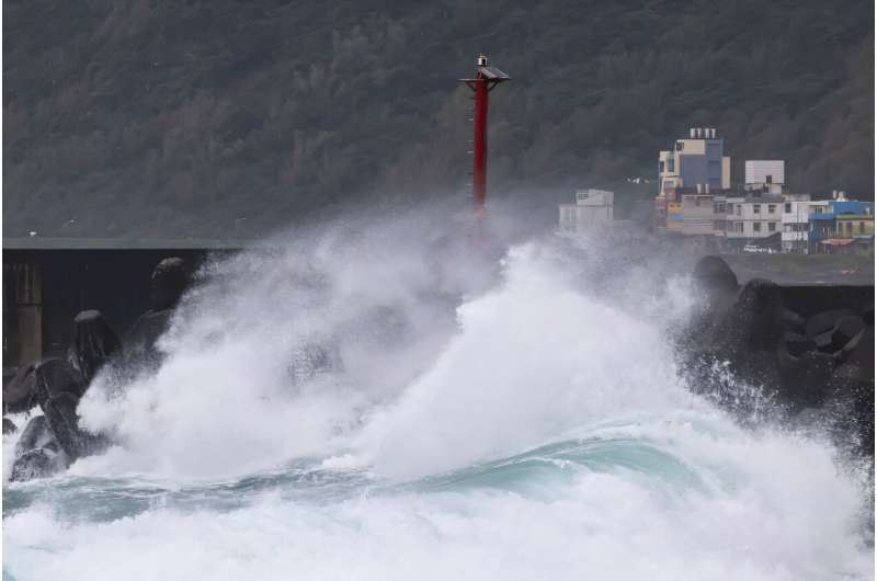 Strong waves crash against a break wall as Super Typhoon Kong-rey moves towards Taiwan