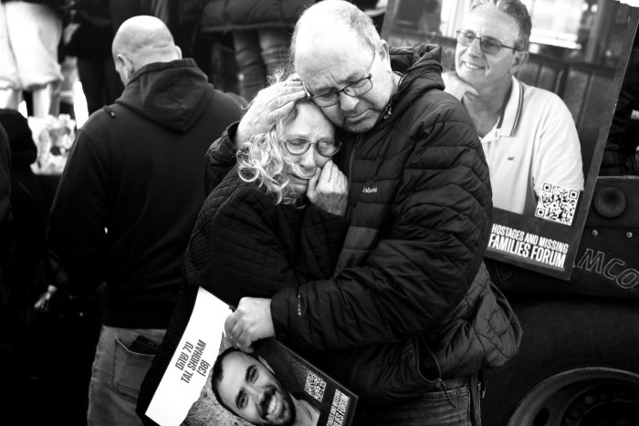 A tearful Gilad and Nitza Korngold hug each other