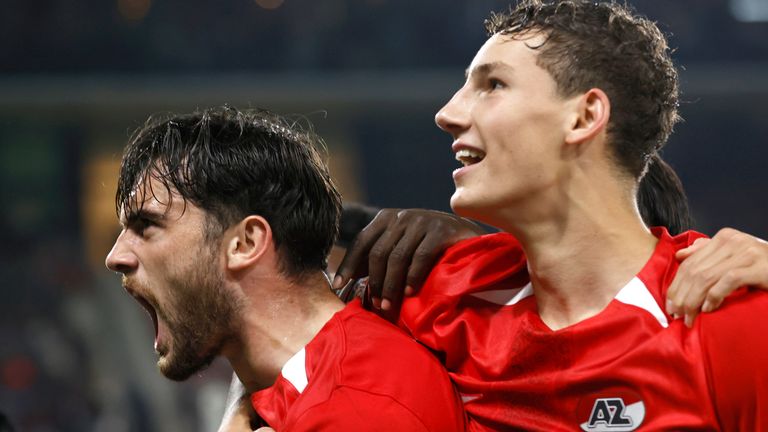 AZ Alkmaar's Troy Parrott, left, celebrates with AZ Alkmaar's Ruben van Bommel after scoring his side's third goal during the Europa League soccer match between AZ Alkmaar and Elfsborg at the AFAS stadium, in Alkmaar, Netherlands, Wednesday, Oct. 25, 2024. (AP Photo/Maurice van Steen)