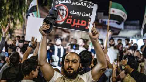 Syrians celebrate in rebel-held Idlib on Saturday after the death of Hizbollah leader Hassan Nasrallah