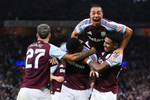 Jhon Duran of Aston Villa celebrates with teammates after scoring.