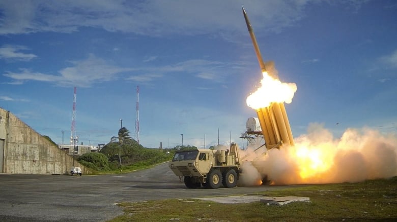 A military vehicle launches a rocket.