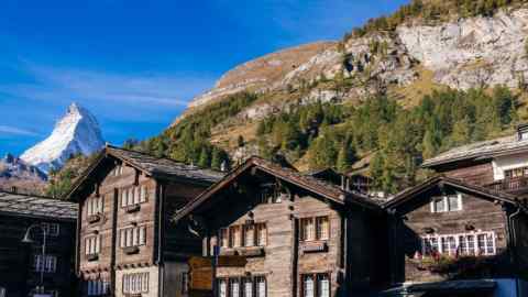 Scenic view of traditional wooden houses in a Swiss mountain village