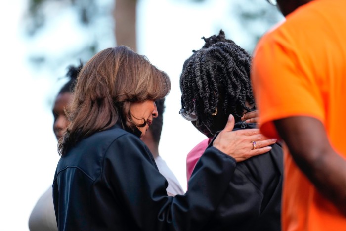 Kamala Harris comforts people as she visits an area impacted by Hurricane Helene in Augusta, Georgia