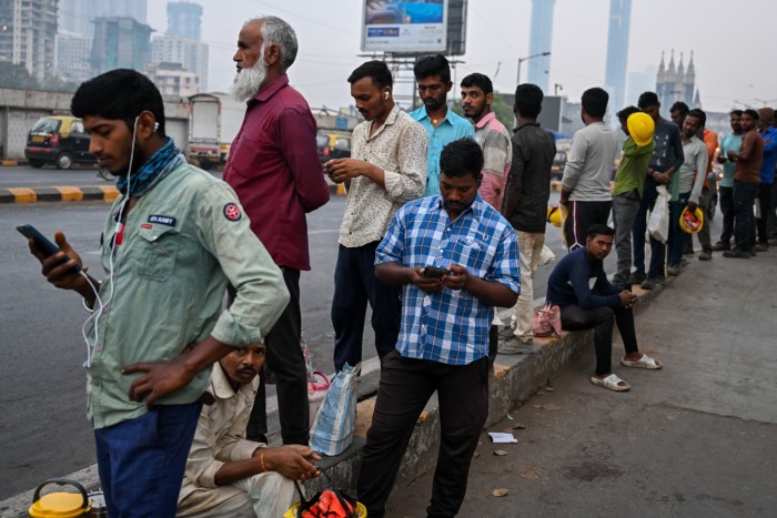 Daily wage labourers wait for work in Mumbai