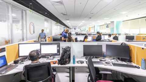 Workers at the Siemens Healthineers AG global capability center (GCC) in Bengaluru