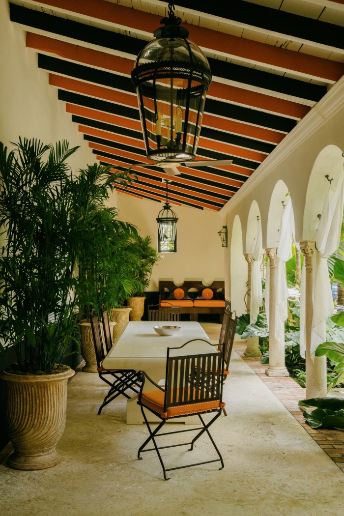 Jamb lanterns and 1940s French chairs by the interior courtyard