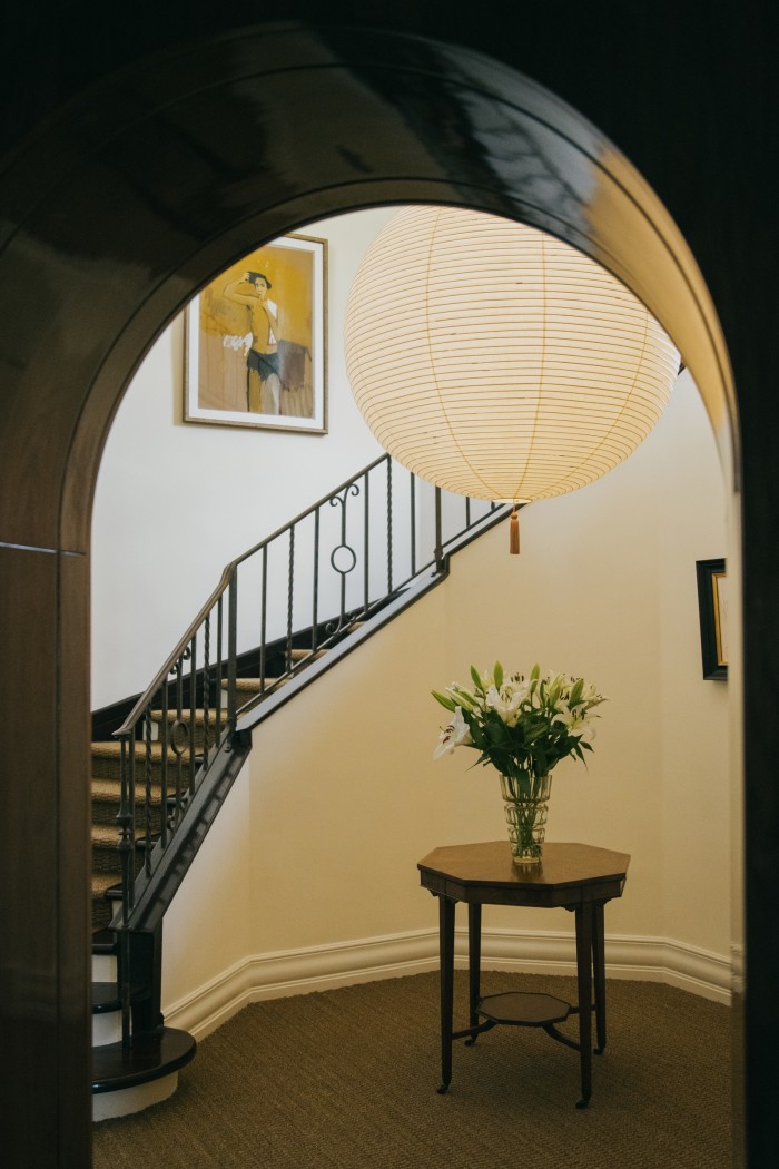 An Isamu Noguchi rice paper lamp in a hallway