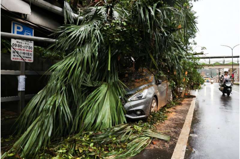 Typhoon Kong-rey has weakened to a severe tropical storm after causing flooding and triggering landslides in Taiwan