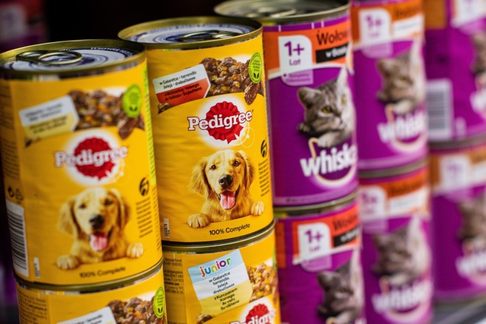 Cans of Pedigree dog food on a store shelf 