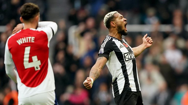 Newcastle forward Joelinton gees up the St James' Park crowd