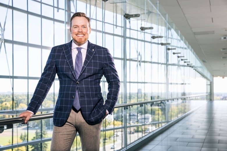 Dr. Adam Kinnaird smiles at the camera. 