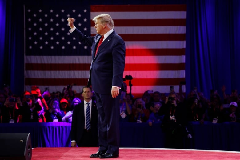  Republican presidential candidate and former U.S. President Donald Trump walks offstage after his remarks at the Conservative Political Action Conference (CPAC) at the Gaylord National Resort Hotel And Convention Center on February 24, 