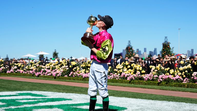 Jockey Robbie Dolan kisses his trophy after winning the Melbourne Cup on Knight's Choice