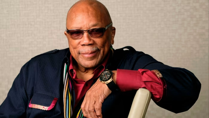 Quincy Jones posing for a picture