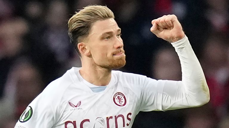 Aston Villa's Matty Cash celebrates his goal against Lille during the Europa Conference League quarter final second leg soccer match between Lille and Aston Villa at the Pierre Mauroy stadium in Villeneuve d'Ascq, northern France, Thursday, April 18, 2024. (AP Photo/Christophe Ena)