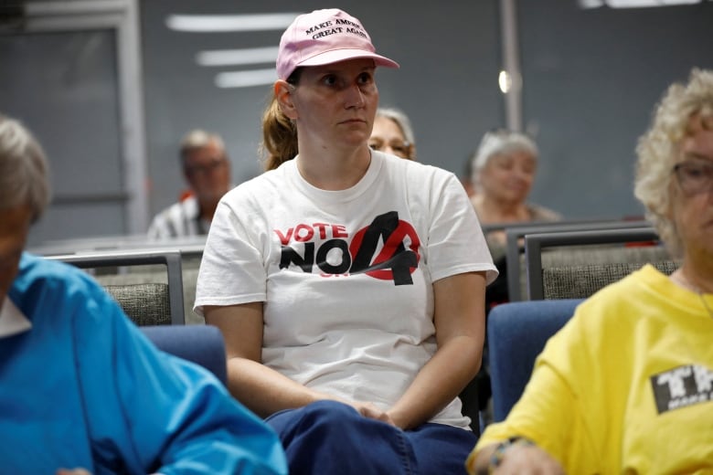 Ashley Urban, wearing a 'Vote No' on Florida Amendment 4 shirt, which addresses the state’s abortion bill, gathers with other parishioners for an Election Eve Service of Prayer, in support of Republican Presidential nominee and former U.S. President Donald Trump at Suncoast Liberty Fellowship in Largo, Florida, U.S., November 4, 2024. REUTERS/Octavio Jones