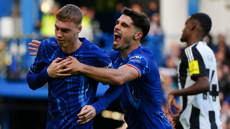 Chelsea's Cole Palmer celebrates with team-mate Pedro Neto after scoring his side's second goal (AP Photo/Dave Shopland)