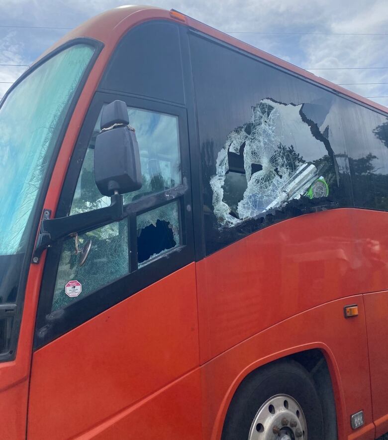 Broken window of bus. 