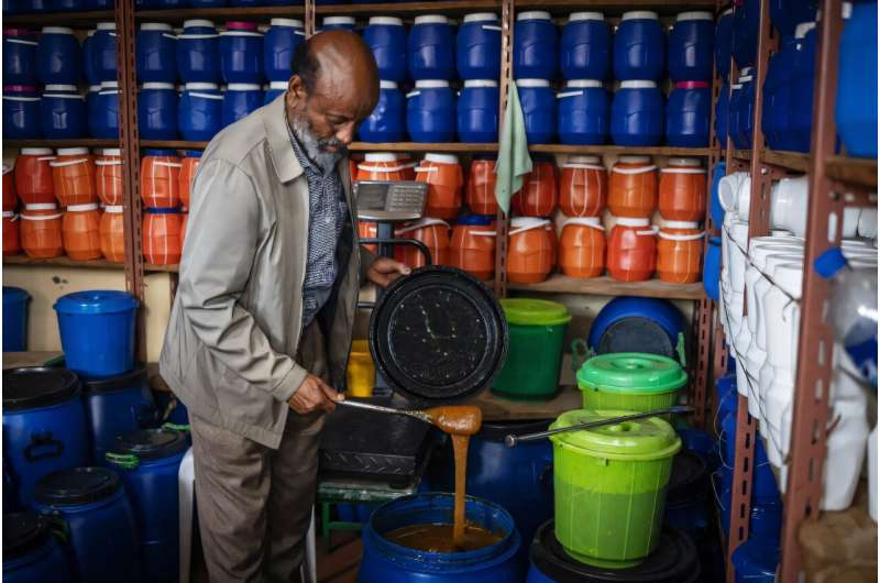 Honey seller Birhanu Araya says he has less to sell at his shop as the war affected bees