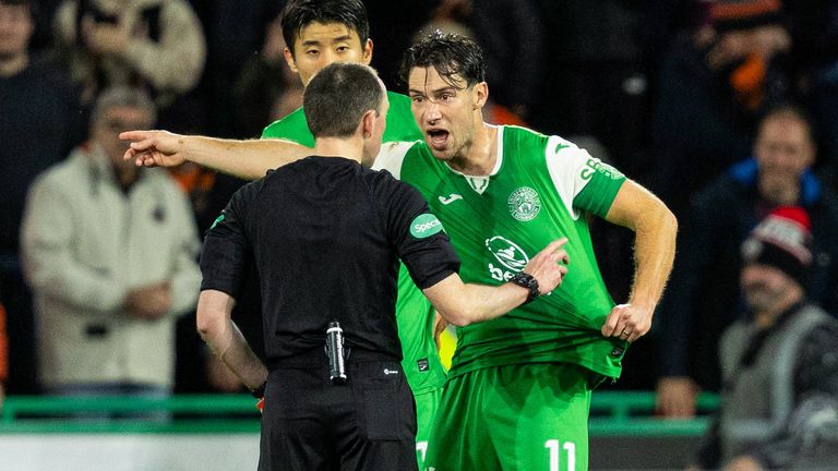 EDINBURGH, SCOTLAND - NOVEMBER 03: Hibernian&#39;s Joe Newell (R) argues with referee Colin Steven (L) after Mykola Kuharevich is sent off after consulting with VAR during a William Hill Premiership game between Hibernian and Dundee United at Easter Road, on November 03, 2024, in Edinburgh, Scotland. (Photo by Ross Parker / SNS Group)