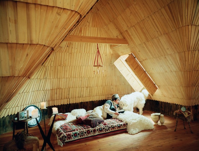 Olowska in the attic room with Bronka; the roof was renovated by local craftsman Tadeusz Harkabuz