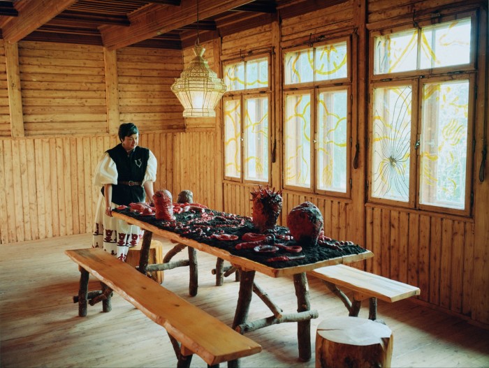 Olowska standing by Luka Woźniczko’s Hekate table