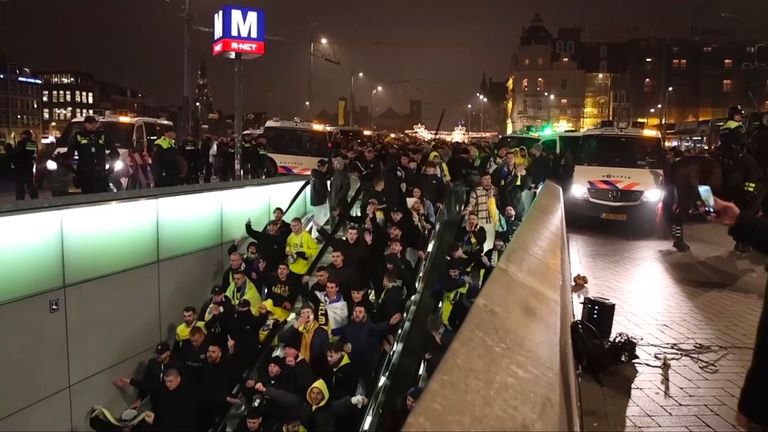 Maccabi Tel Aviv supporters being escorted to the metro station by police