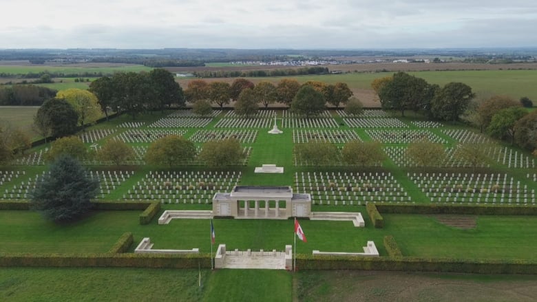 A vast cometary full of white headstones