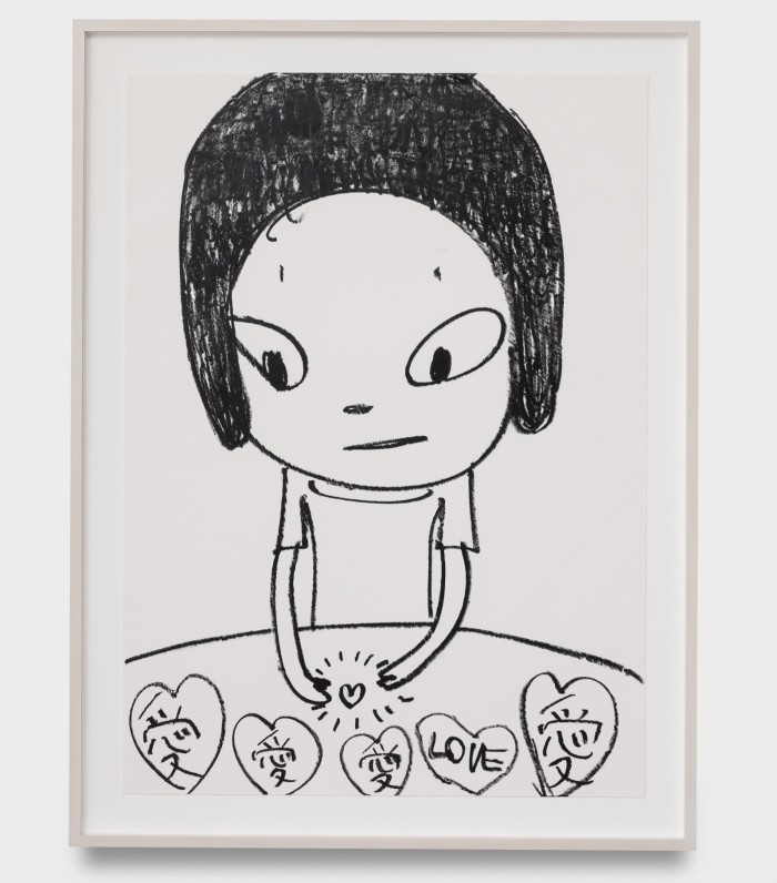 A painting depicts a simplified image of a young woman with an array of heart shapes before her, containing Japanese characters and the word ‘Love’ in English; between her hands she holds a radiating heart