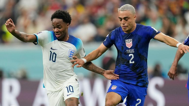 Raheem Sterling dribbles away from Sergino Dest 