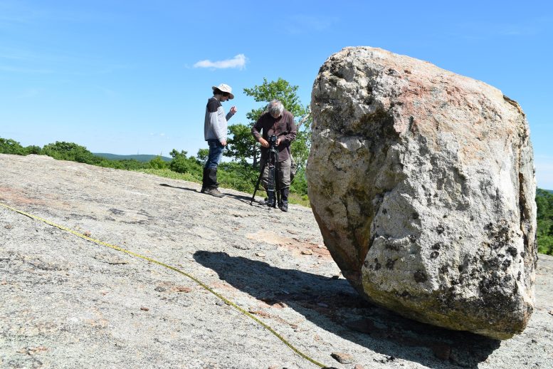 William Menke and Student Studying Precarious Boulder