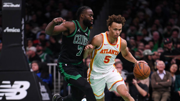 Dyson Daniels of the Atlanta Hawks brings the ball up court against Jaylen Brown of the Boston Celtics during the first half of their NBA Cup clash.