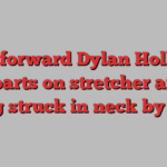 Blues forward Dylan Holloway departs on stretcher after being struck in neck by puck