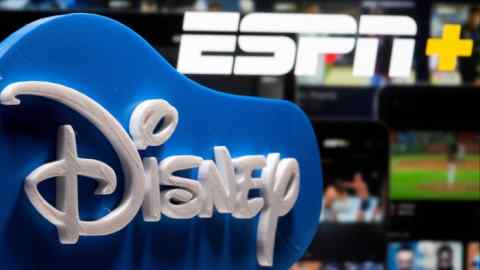 A 3D printed Disney logo is placed in front of a blue background, with the ESPN+ logo visible in the background.