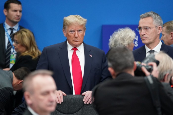 Donald Trump stands among other leaders as he attends a Nato summit in Watford, near London, UK