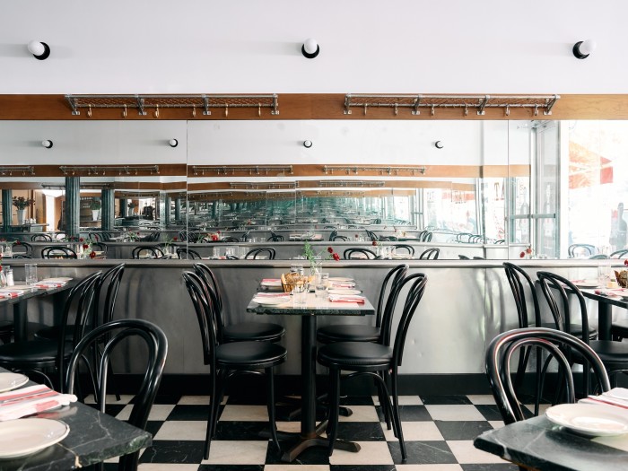 Tables in the mirrored dining area at EAT