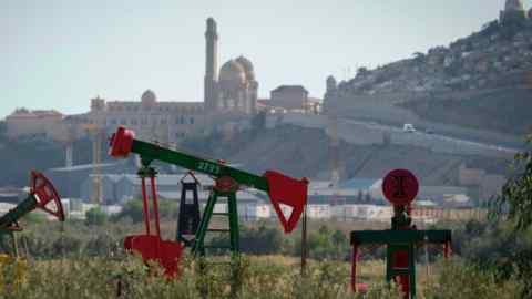 A pump jack operating on the outskirts of Baku, Azerbaijan