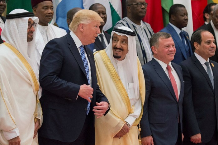 Donald Trump and King Salman bin Abdulaziz al-Saud stand next to each other for a group photo at the Gulf Cooperation Council summit in Riyadh, Saudi Arabia in May 2017