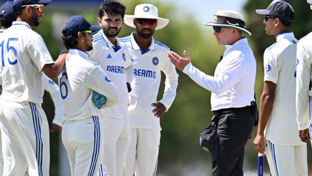 Umpire Shawn Craig speaking to India A players in Mackay.