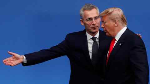 NATO Secretary General Jens Stoltenberg (L) welcomes US President Donald Trump (R) upon his arrival for the NATO summit