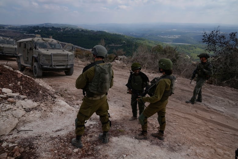 Israeli soldiers are seen during a ground operation in southern Lebanon, near the border with Israel, Sunday, Oct. 13, 2024.