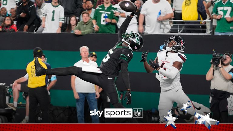 New York Jets wide receiver Garrett Wilson (5) catches a pass for a touchdown as Houston Texans cornerback Kamari Lassiter (4) defends during the second half of an NFL football game Thursday, Oct. 31, 2024, in East Rutherford, N.J. (AP Photo/Frank Franklin II)


