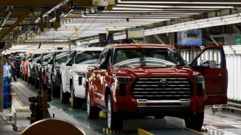 Tundra trucks and Sequoia SUVs are lined up as they exit the assembly line at Toyota's truck plant in San Antonio, Texas