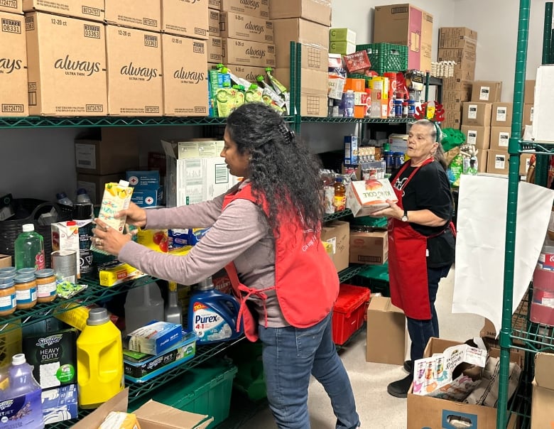 Staff and volunteers at the Salvation Army food bank in Sydney prepare for the Christmas distribution.